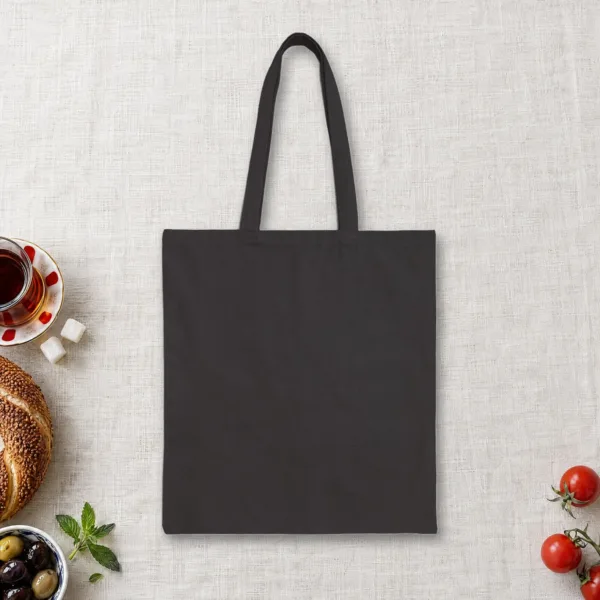 Plain back of the black canvas tote with the A City with Wisdom to Share Night design, printed on the front only
