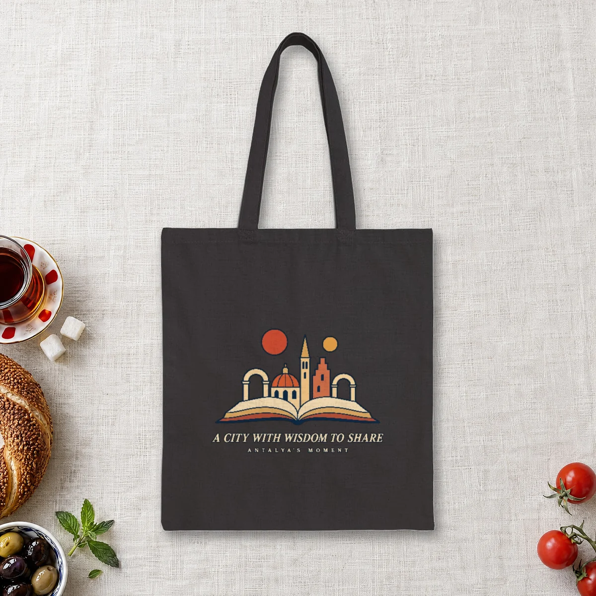 A City with Wisdom to Share Night design on a black canvas tote, laid flat