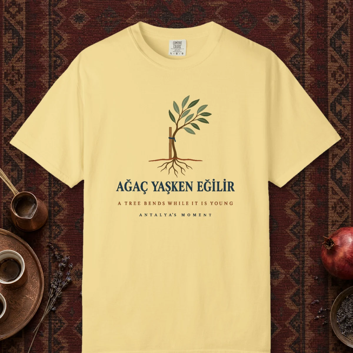 A Tree Bends While It Is Young Tee in Butter, front view