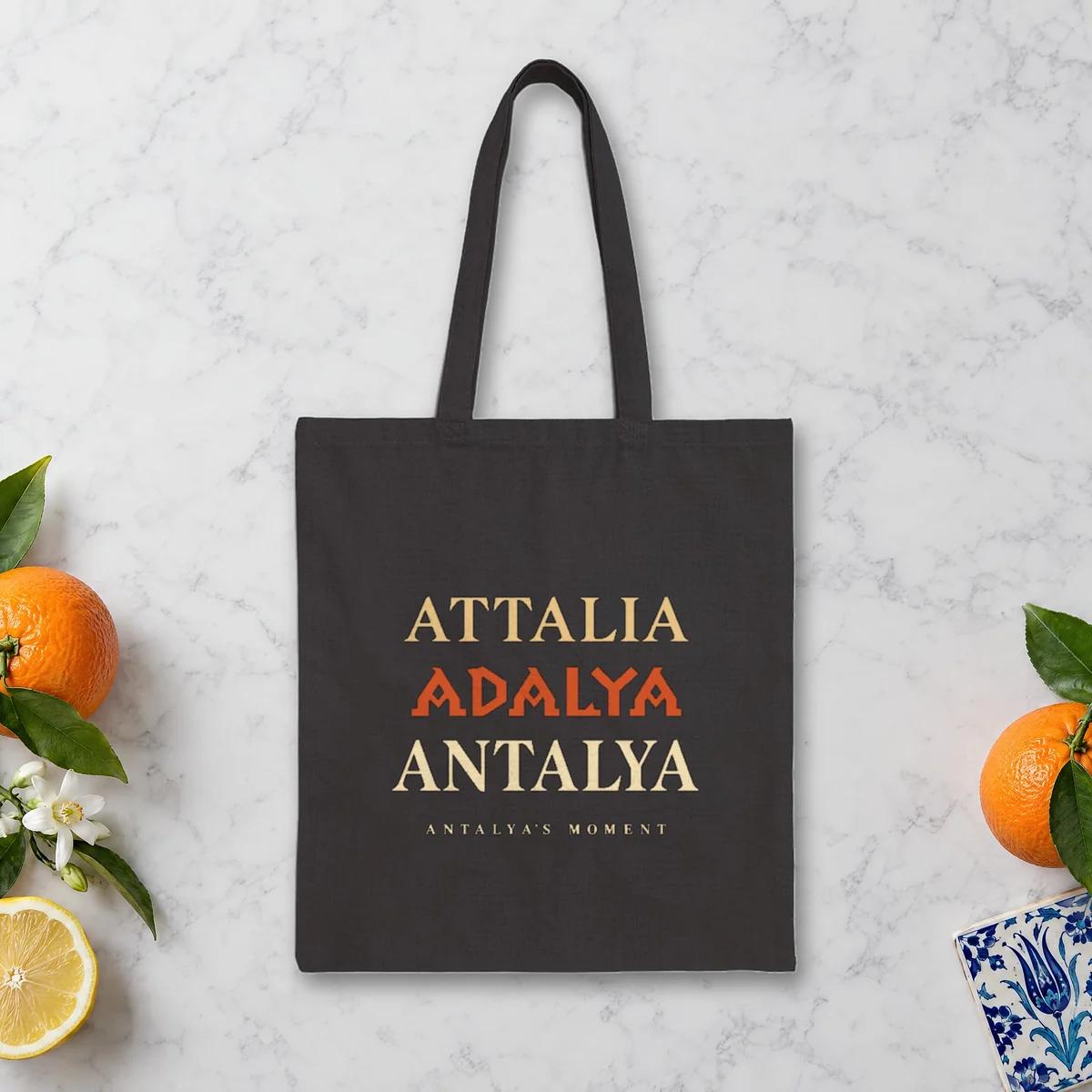 Attalia Adalya Antalya Night design on a black canvas tote, laid flat