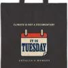 Close-up of the Climate Is Not a Documentary Night design printed on a black canvas tote, with the top seam and handles