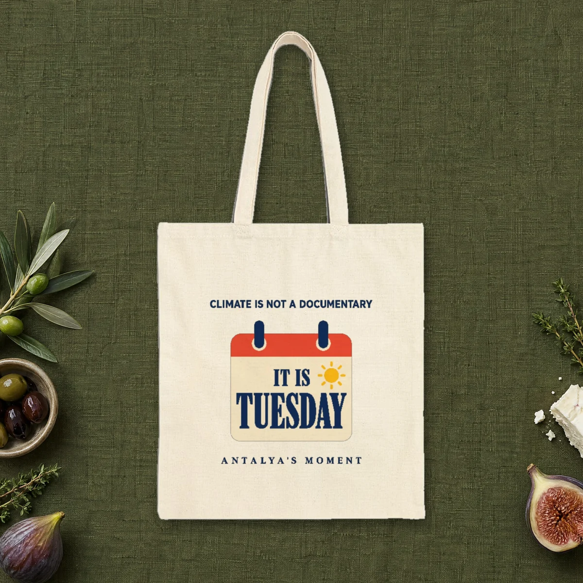 Climate Is Not a Documentary design on a natural canvas tote, laid flat