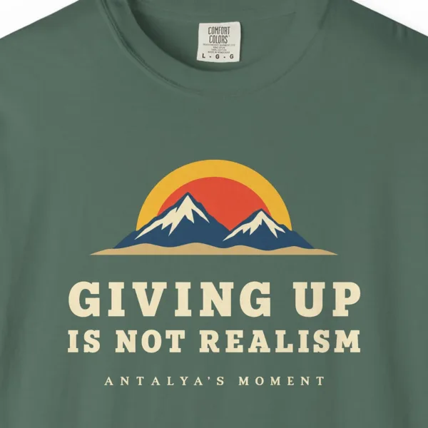 Giving Up Is Not Realism Night Tee in Blue Spruce, close-up