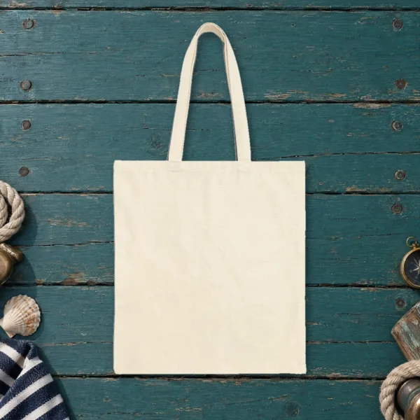 Plain back of the natural canvas tote with the Giving Up Is Not Realism design, printed on the front only