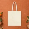 Plain back of the natural canvas tote with the Hüzün design, printed on the front only