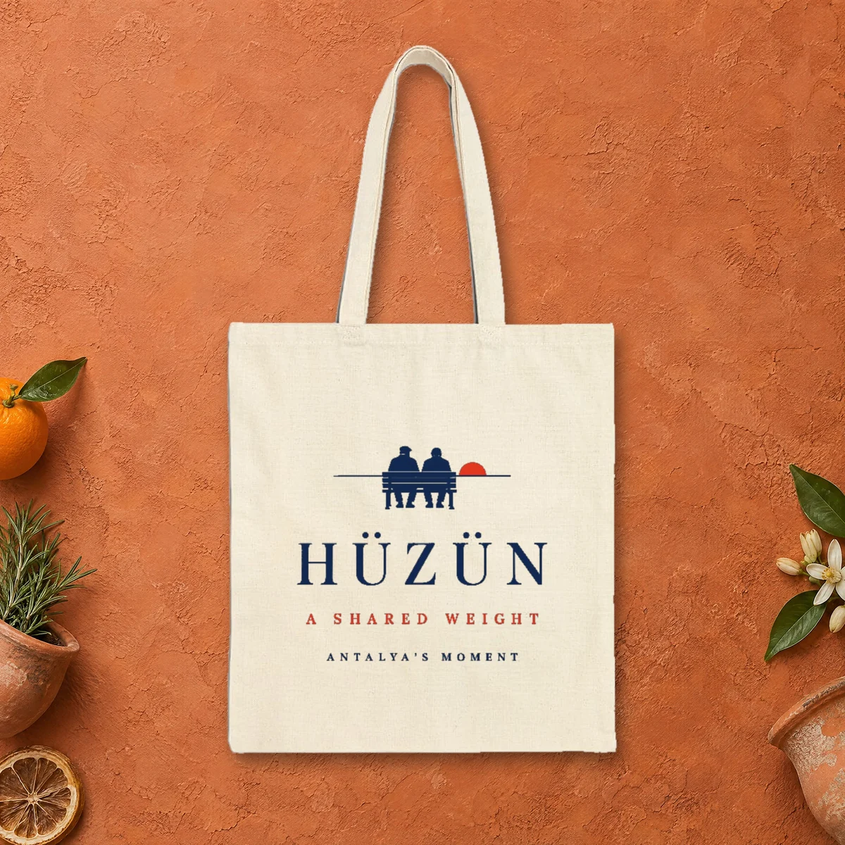 Hüzün design on a natural canvas tote, laid flat