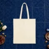 Plain back of the natural canvas tote with the More Than a Venue design, printed on the front only