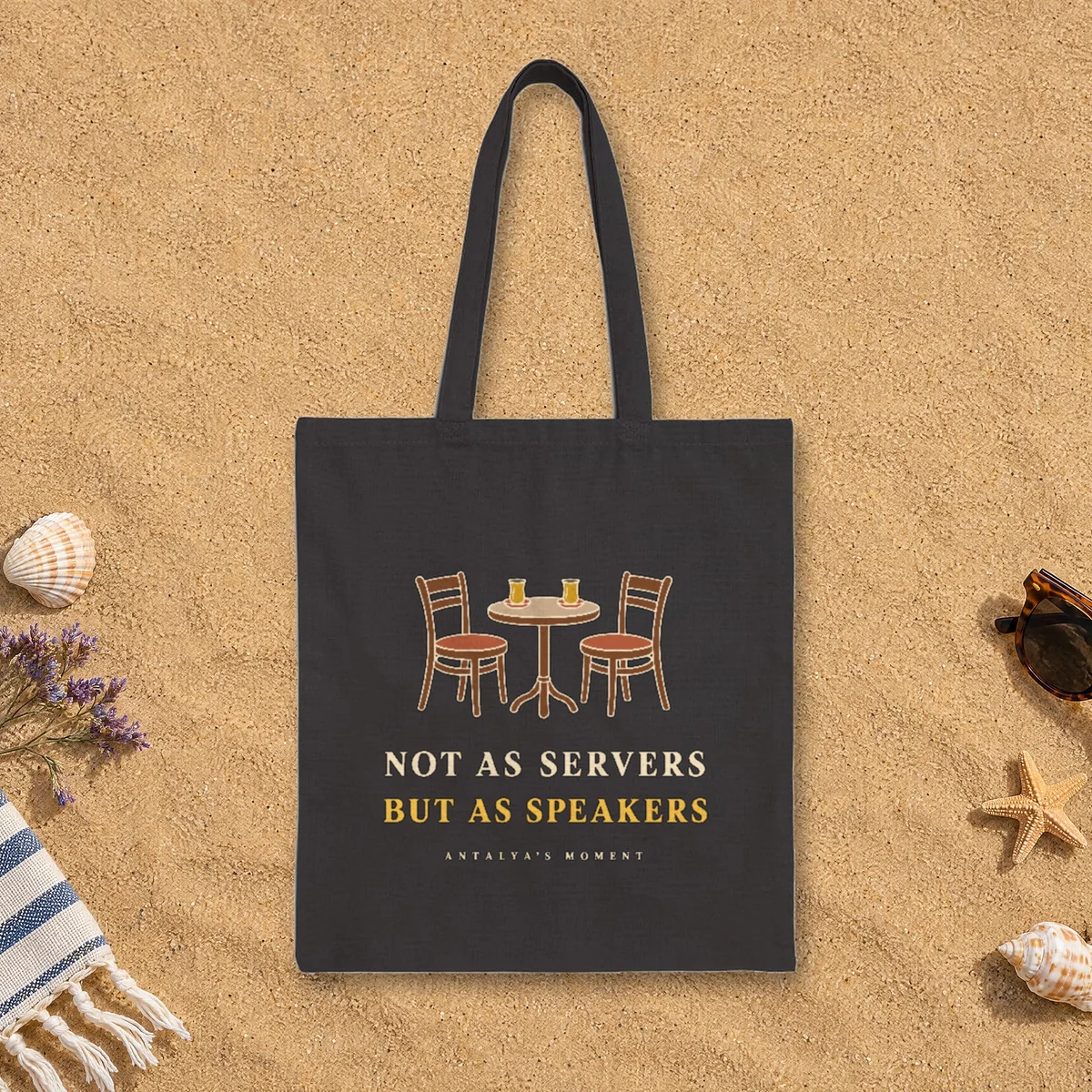 Not as Servers, but as Speakers Night design on a black canvas tote, laid flat
