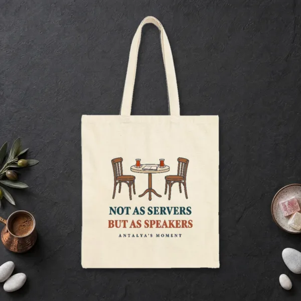 Not as Servers, but as Speakers design on a natural canvas tote, laid flat