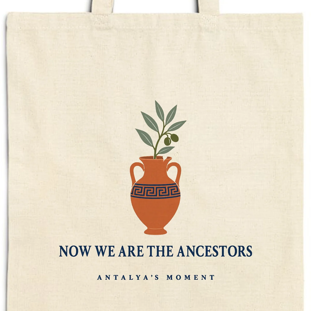 now-we-are-the-ancestors-tote-natural-detail-v1 Close-up of the Now We Are the Ancestors design printed on a natural canvas tote, with the top seam and handles