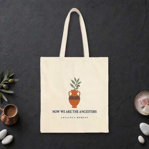 Now We Are the Ancestors design on a natural canvas tote, laid flat