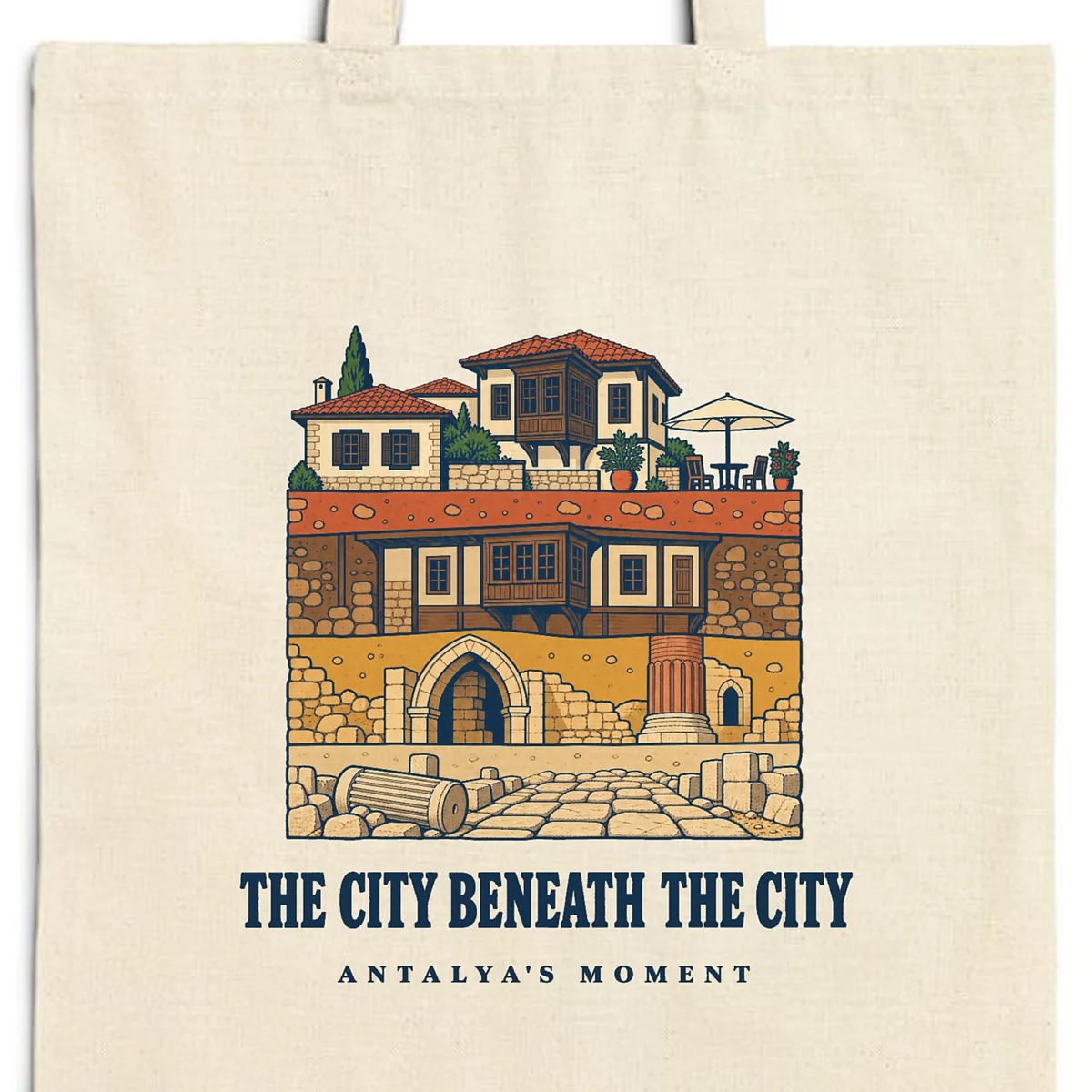 Close-up of the The City Beneath the City design printed on a natural canvas tote, with the top seam and handles