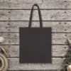 Plain back of the black canvas tote with the The Wisdom of Enough Night design, printed on the front only