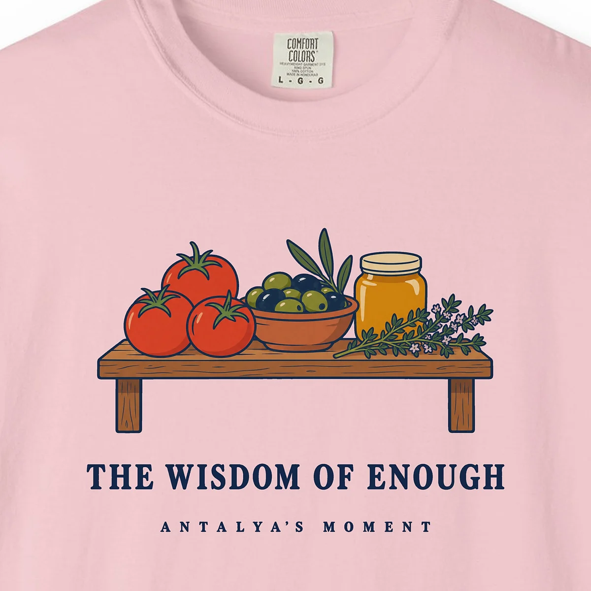 The Wisdom of Enough Tee in Blossom, close-up