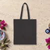 we-will-try-night-tote-black-back-v1 Plain back of the black canvas tote with the We Will Try Night design, printed on the front only